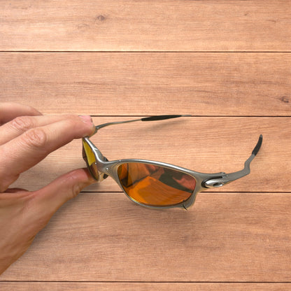 Insane metal frame sunglasses in silver with orange lense.