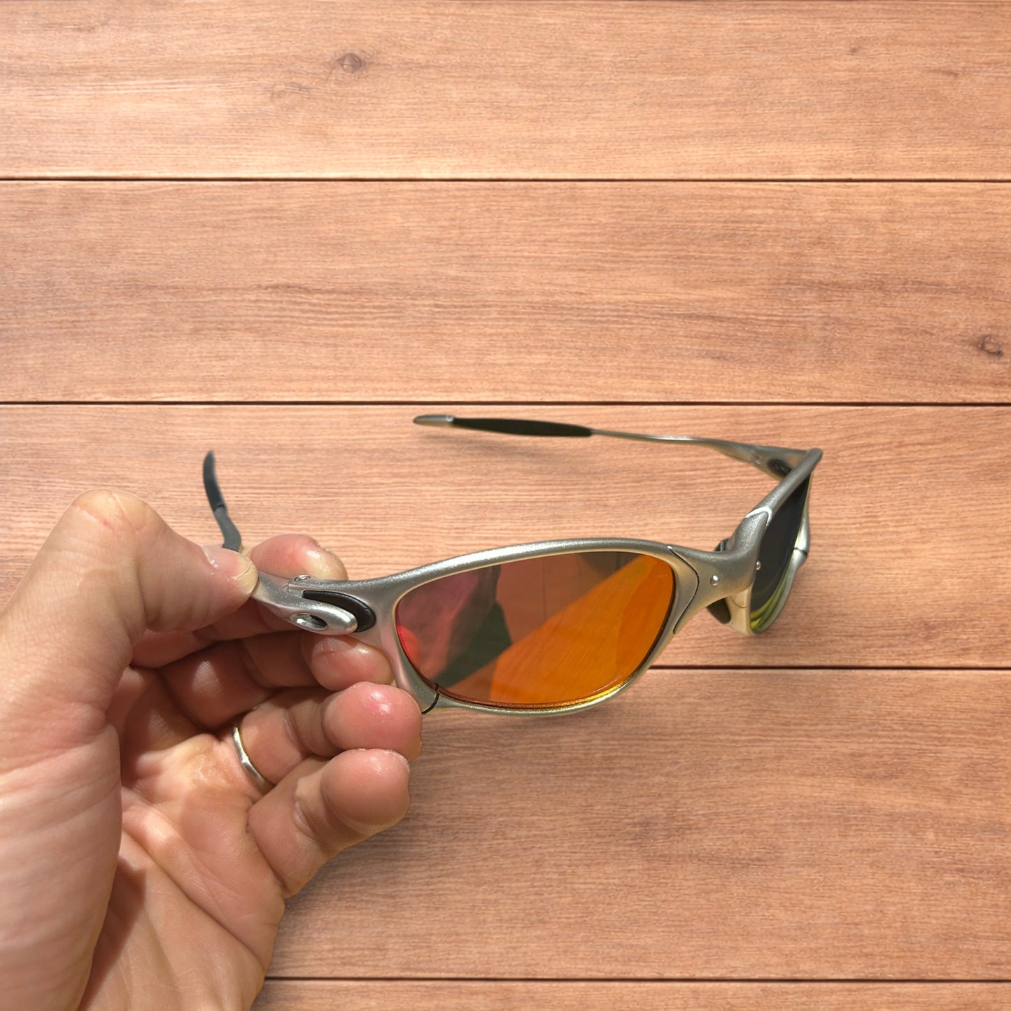 Insane metal frame sunglasses in silver with orange lense.