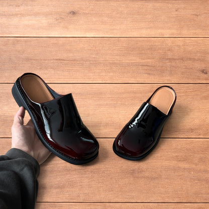 Faux leather slip on clogs slippers in oxblood red.