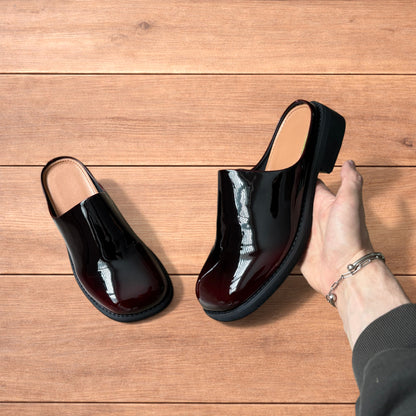 Lovely faux leather slip on clogs slippers in oxblood red.