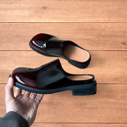 Lovely faux leather slip on clogs slippers in oxblood red.