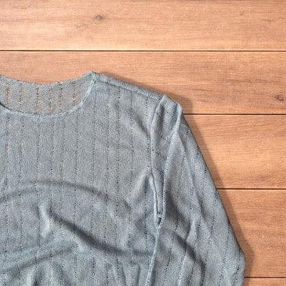 Surfer style baggy long sleeve knit top shirt in light blue.