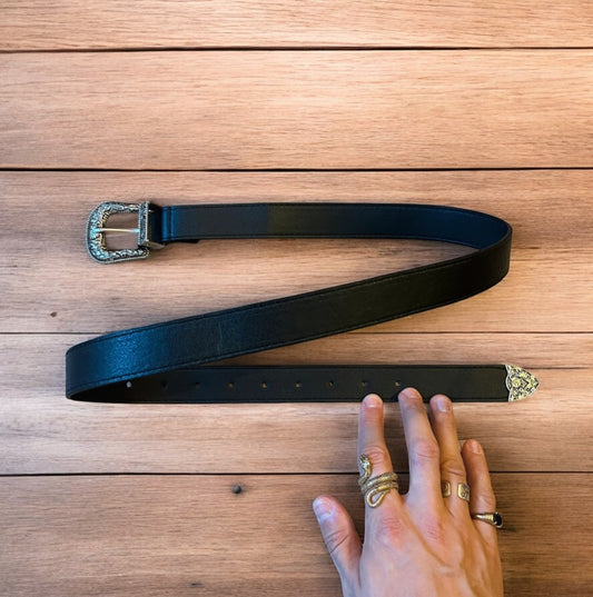 Vintage style faux leather western cowboy belt in black with silver trim. 105cm.