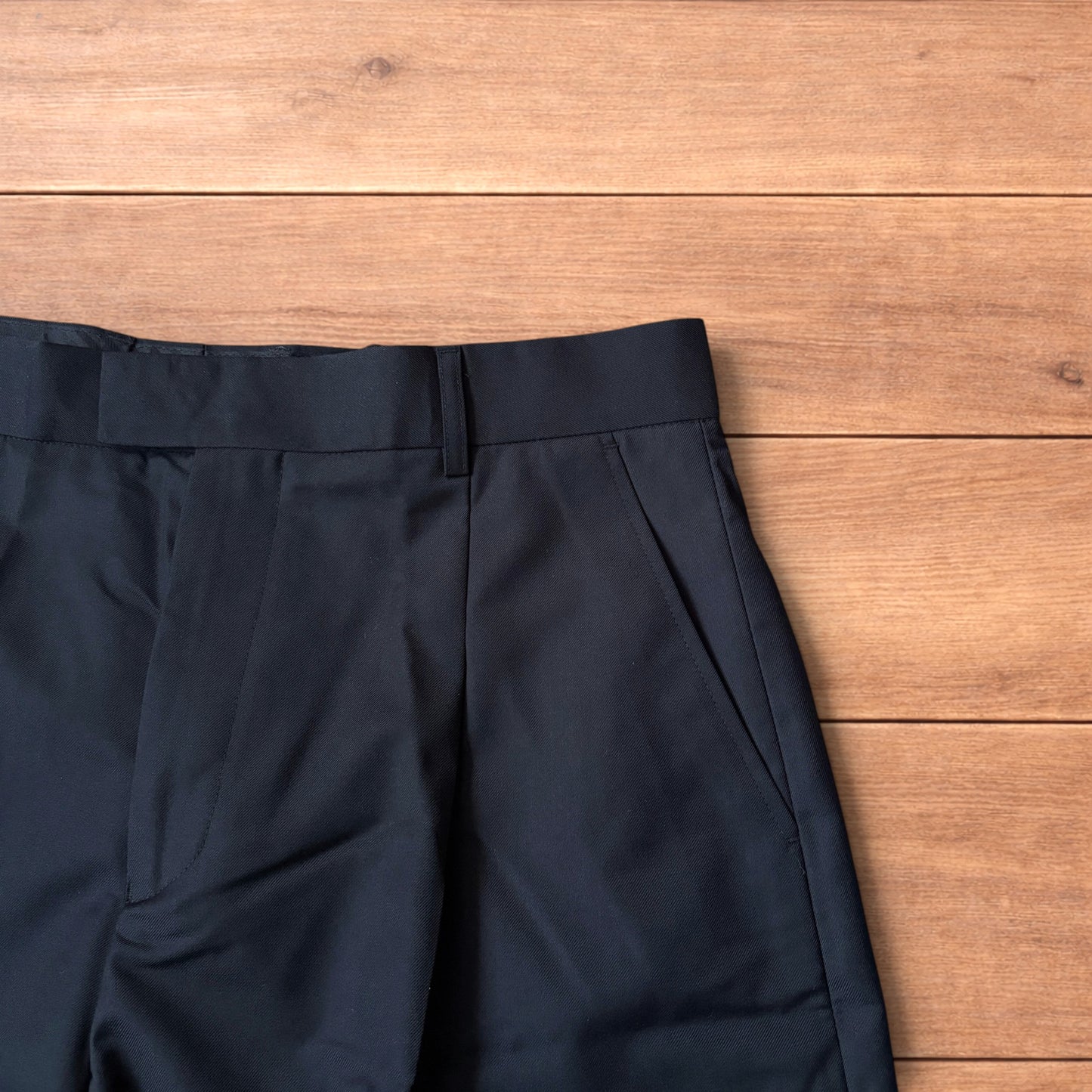 Vintage style baggy wide leg long tailored shorts in black.