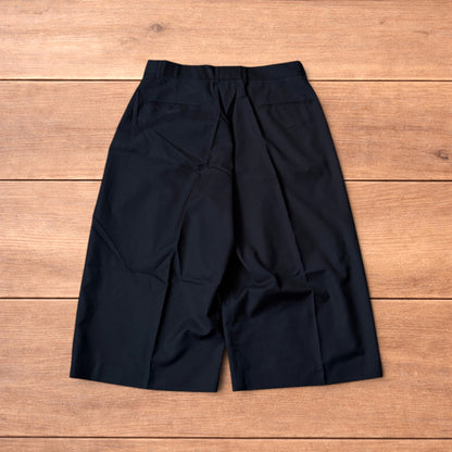 Vintage style baggy wide leg long tailored shorts in black.