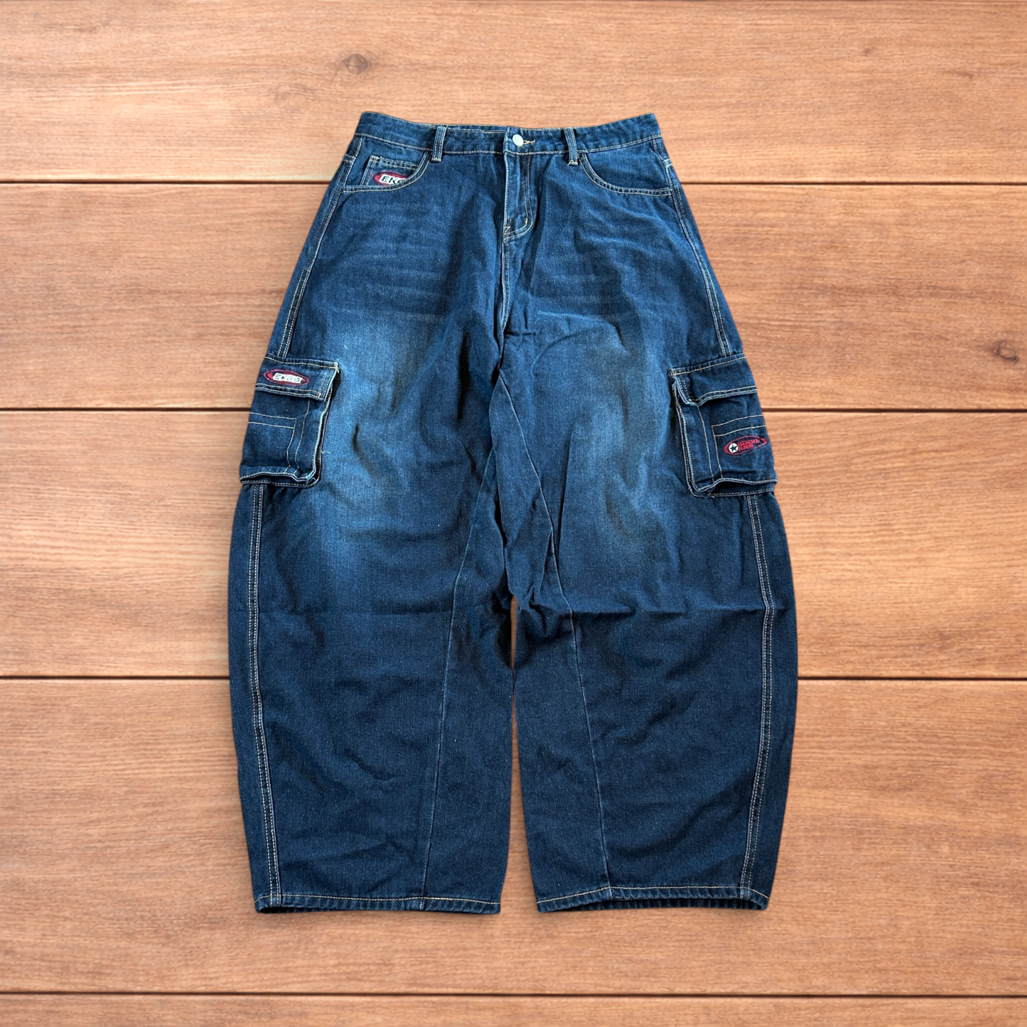 Vintage style baggy wide leg skater fit cargo jeans with embroidery in mid blue.