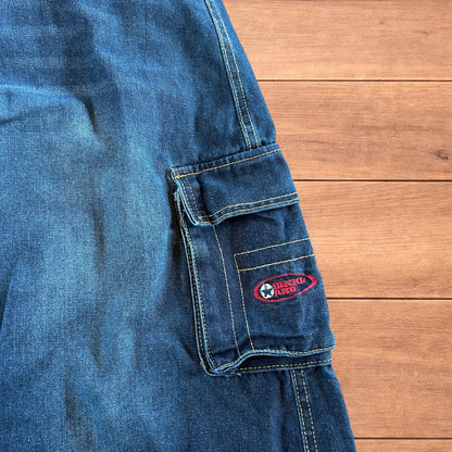 Vintage style baggy wide leg skater fit cargo jeans with embroidery in mid blue.