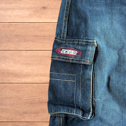 Vintage style baggy wide leg skater fit cargo jeans with embroidery in mid blue.