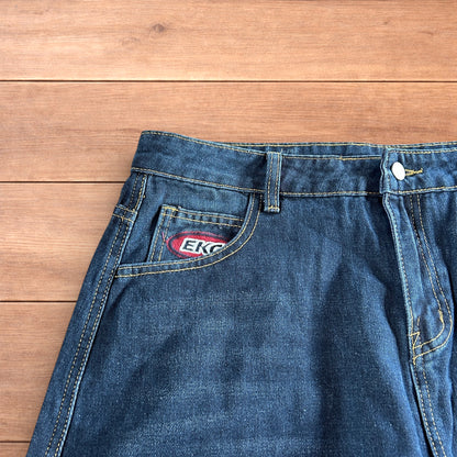 Vintage style baggy wide leg skater fit cargo jeans with embroidery in mid blue.