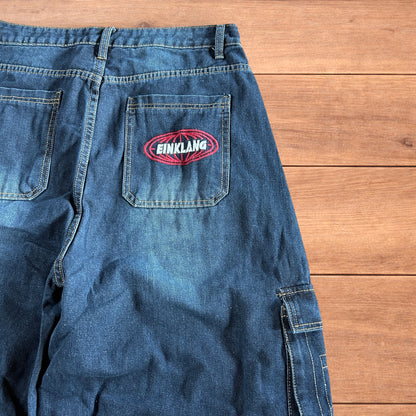 Vintage style baggy wide leg skater fit cargo jeans with embroidery in mid blue.