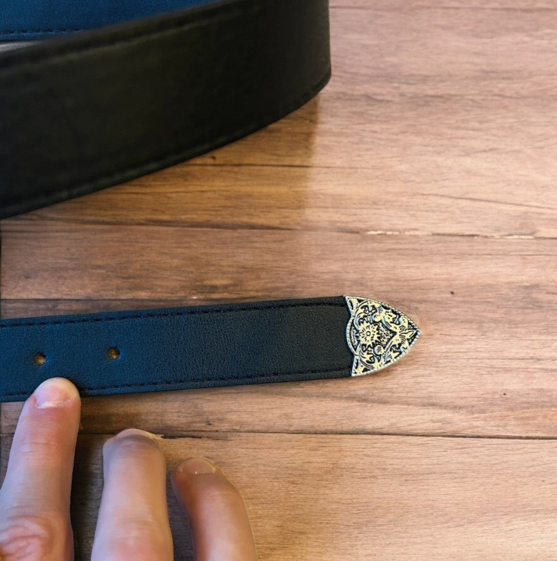Vintage style faux leather western cowboy belt in black with silver trim. 105cm.