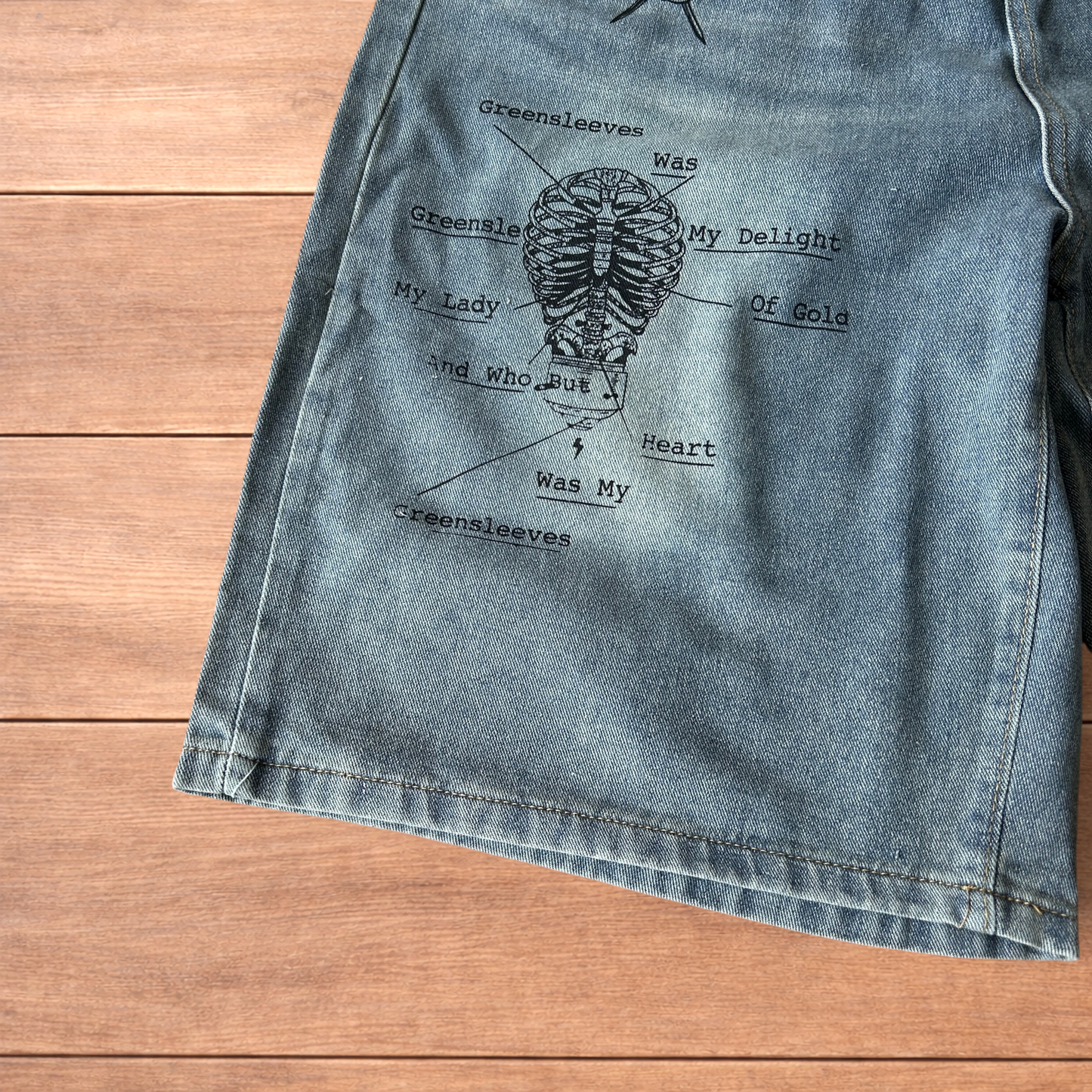 Incredible baggy wide leg denim shorts jorts with graffiti/graphic in light blue.