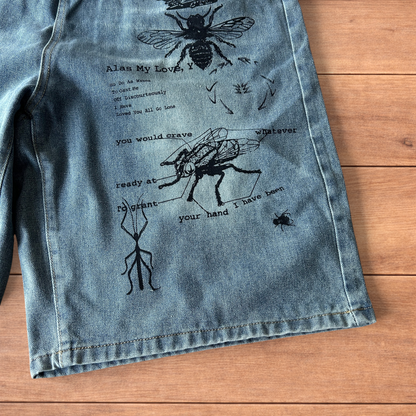 Incredible baggy wide leg denim shorts jorts with graffiti/graphic in light blue.