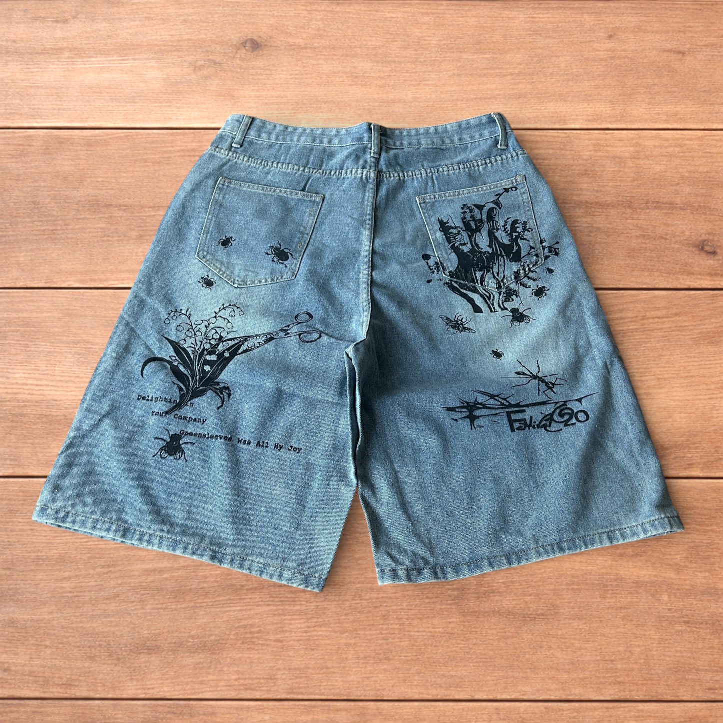 Incredible baggy wide leg denim shorts jorts with graffiti/graphic in light blue.