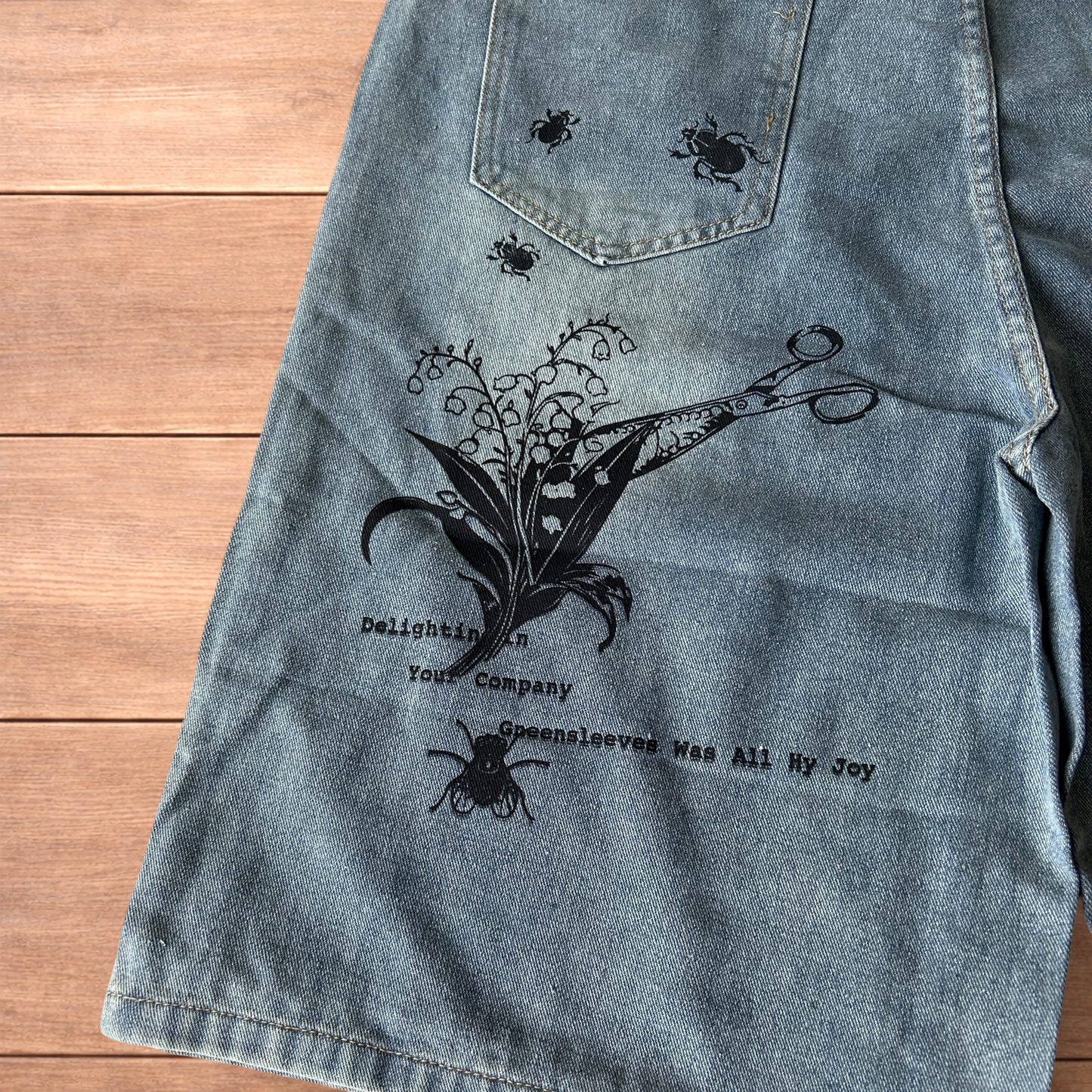 Incredible baggy wide leg denim shorts jorts with graffiti/graphic in light blue.