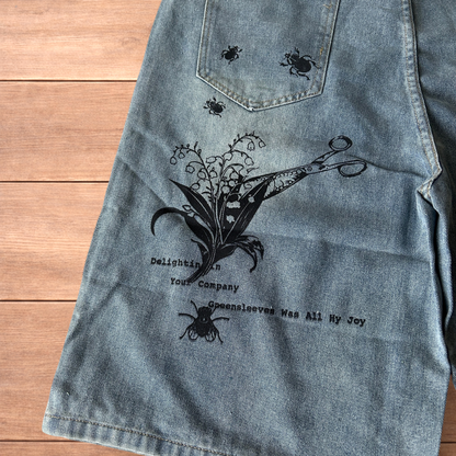 Incredible baggy wide leg denim shorts jorts with graffiti/graphic in light blue.