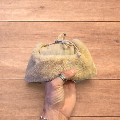 Russian ushanka trapper ear flap winter hat in cream/beige colour way.