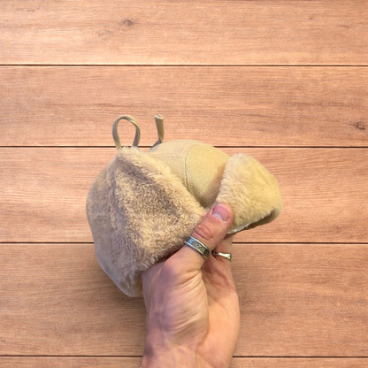 Russian ushanka trapper ear flap winter hat in cream/beige colour way.