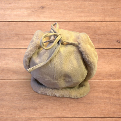 Russian ushanka trapper ear flap winter hat in cream/beige colour way.