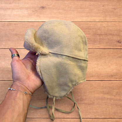 Russian ushanka trapper ear flap winter hat in cream/beige colour way.