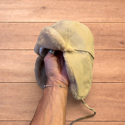 Russian ushanka trapper ear flap winter hat in cream/beige colour way.