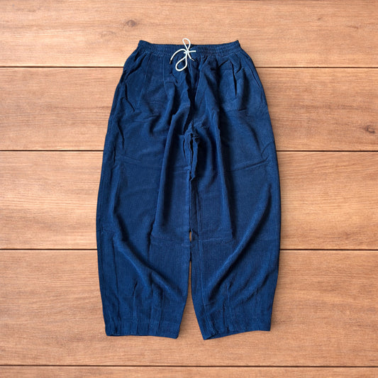Super baggy wide leg skater corduroy trousers in navy blue.
