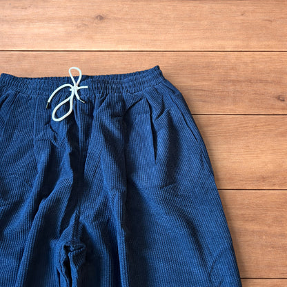 Super baggy wide leg skater corduroy trousers in navy blue.