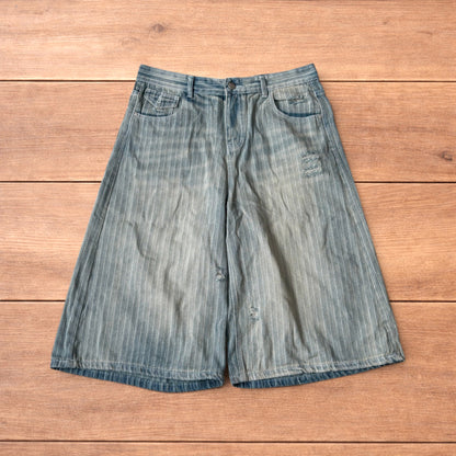 Super baggy wide leg striped denim shorts jorts in light blue.