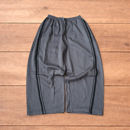 Super baggy wide leg Korean joggers with side stripes in dark grey.