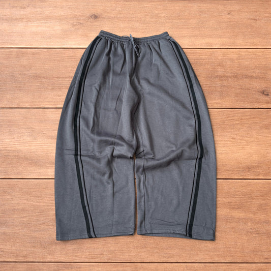 Super baggy wide leg Korean joggers with side stripes in dark grey.