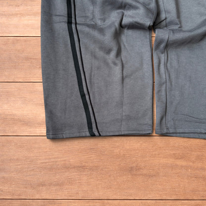 Super baggy wide leg Korean joggers with side stripes in dark grey.