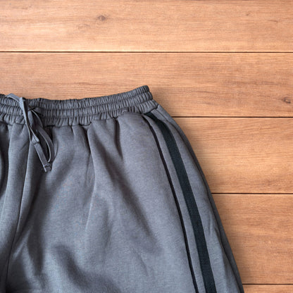 Super baggy wide leg Korean joggers with side stripes in dark grey.
