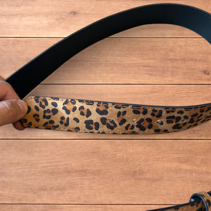 Vintage style faux leather western leopard cowboy belt with bronze trim.