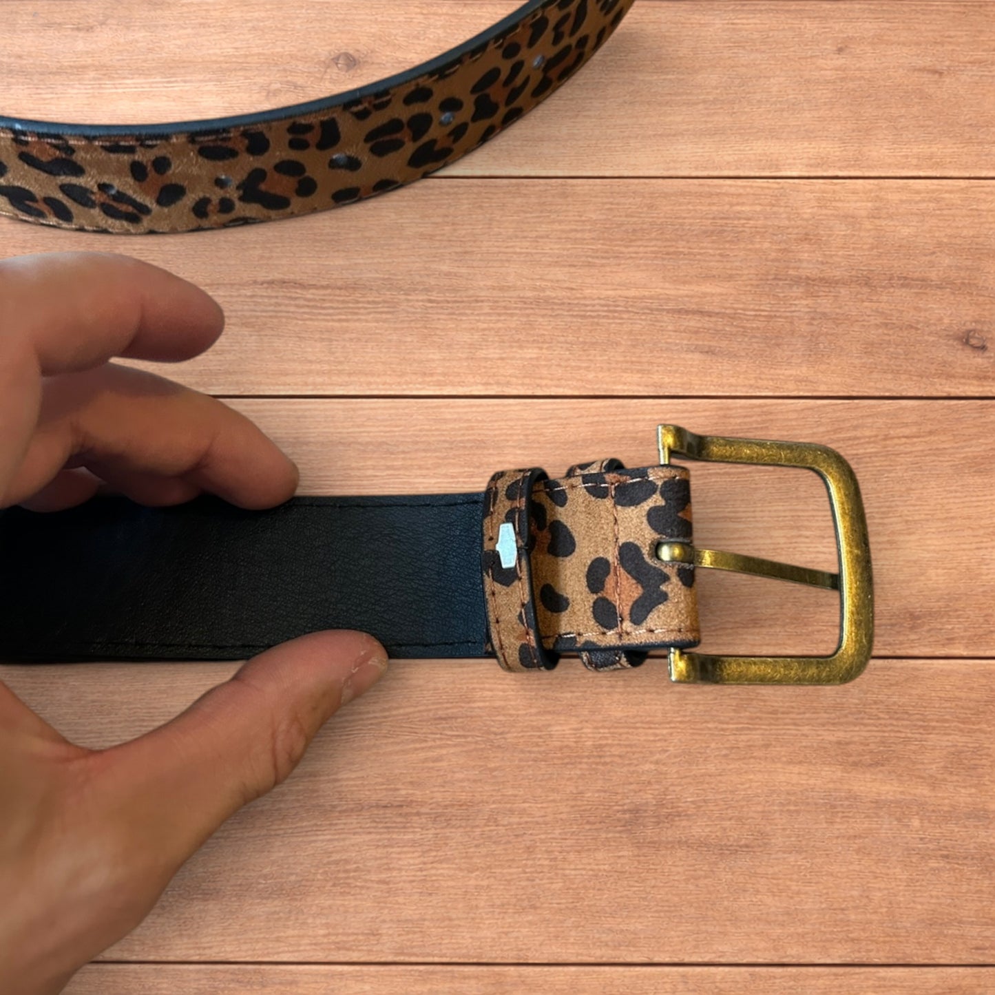 Vintage style faux leather western leopard cowboy belt with bronze trim.