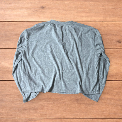 Relaxed fit henley long sleeve top in marl grey laid flat on wooden surface