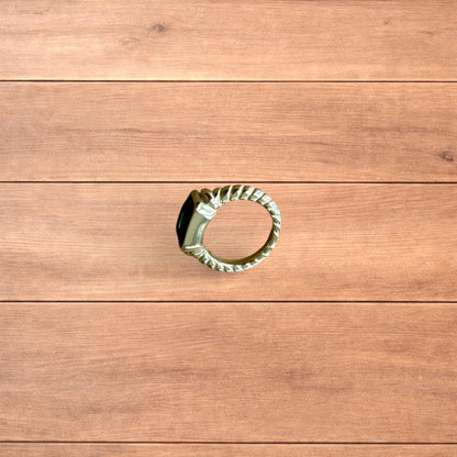 Lovely vintage style gold ring with green gemstone.