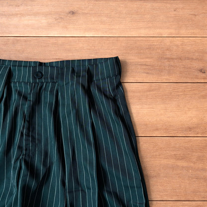 Vintage style baggy wide leg dark green trousers with white pinstripe, button and zip fastening, laid flat