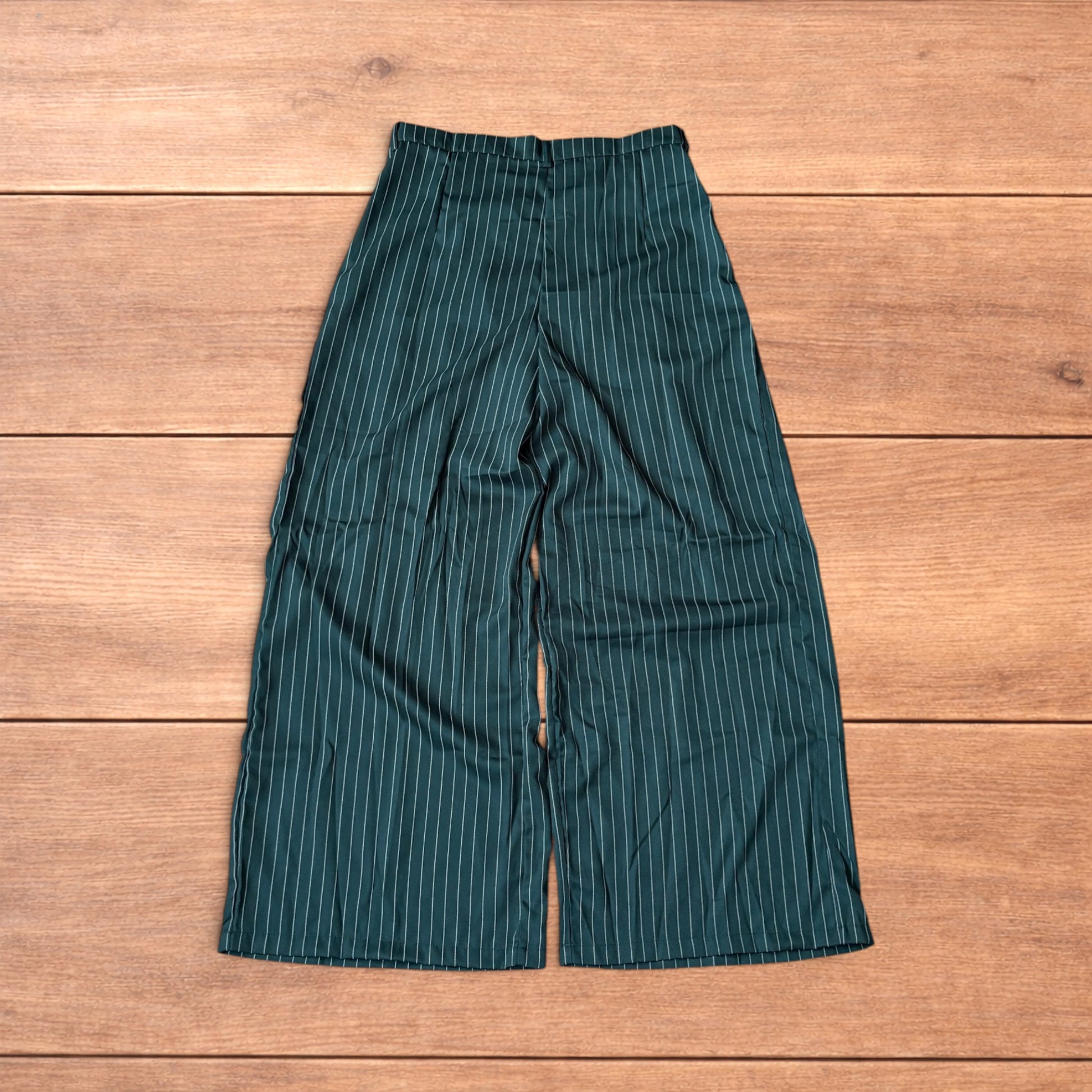 Vintage style baggy wide leg dark green trousers with white pinstripe, button and zip fastening, laid flat