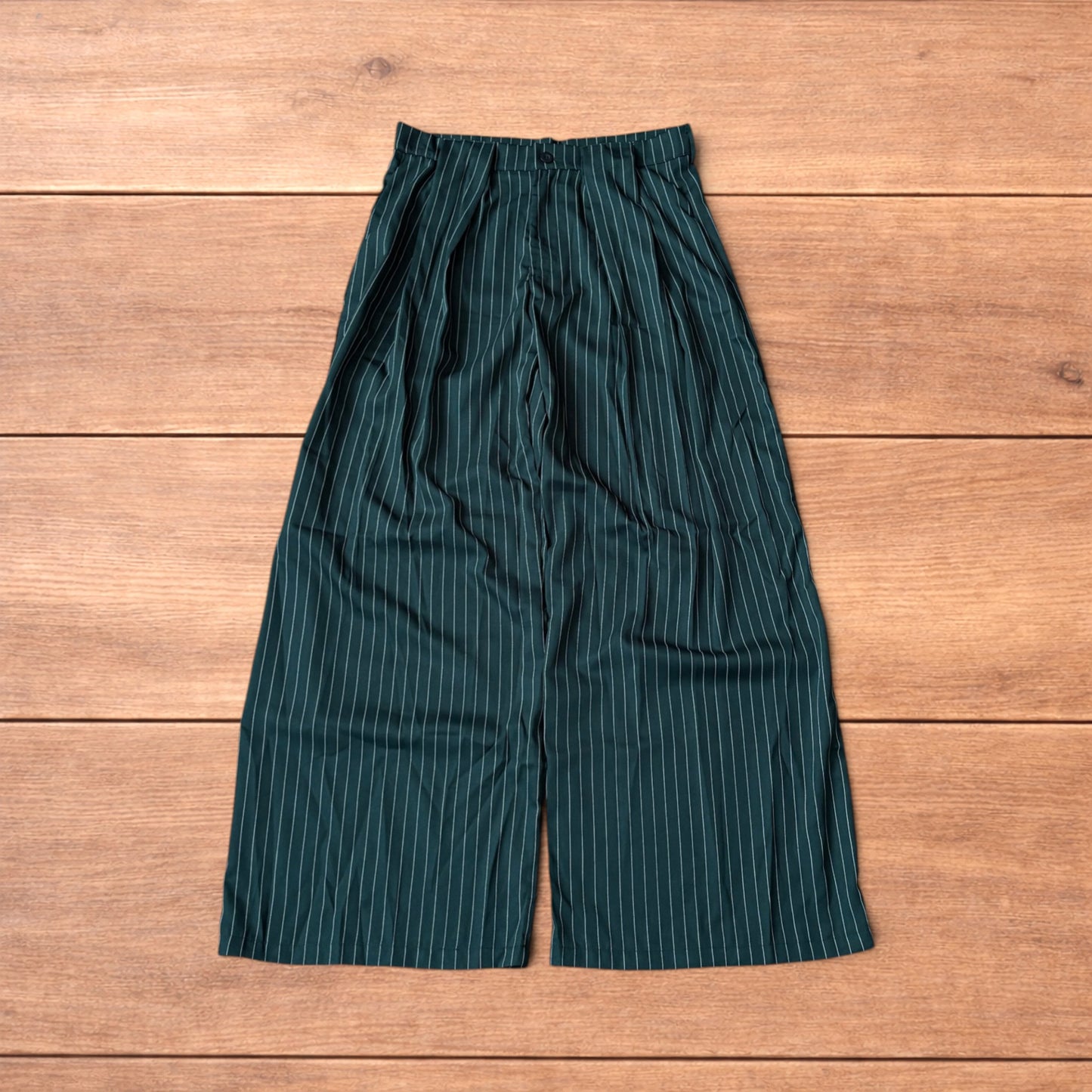 Vintage style baggy wide leg dark green trousers with white pinstripe, button and zip fastening, laid flat