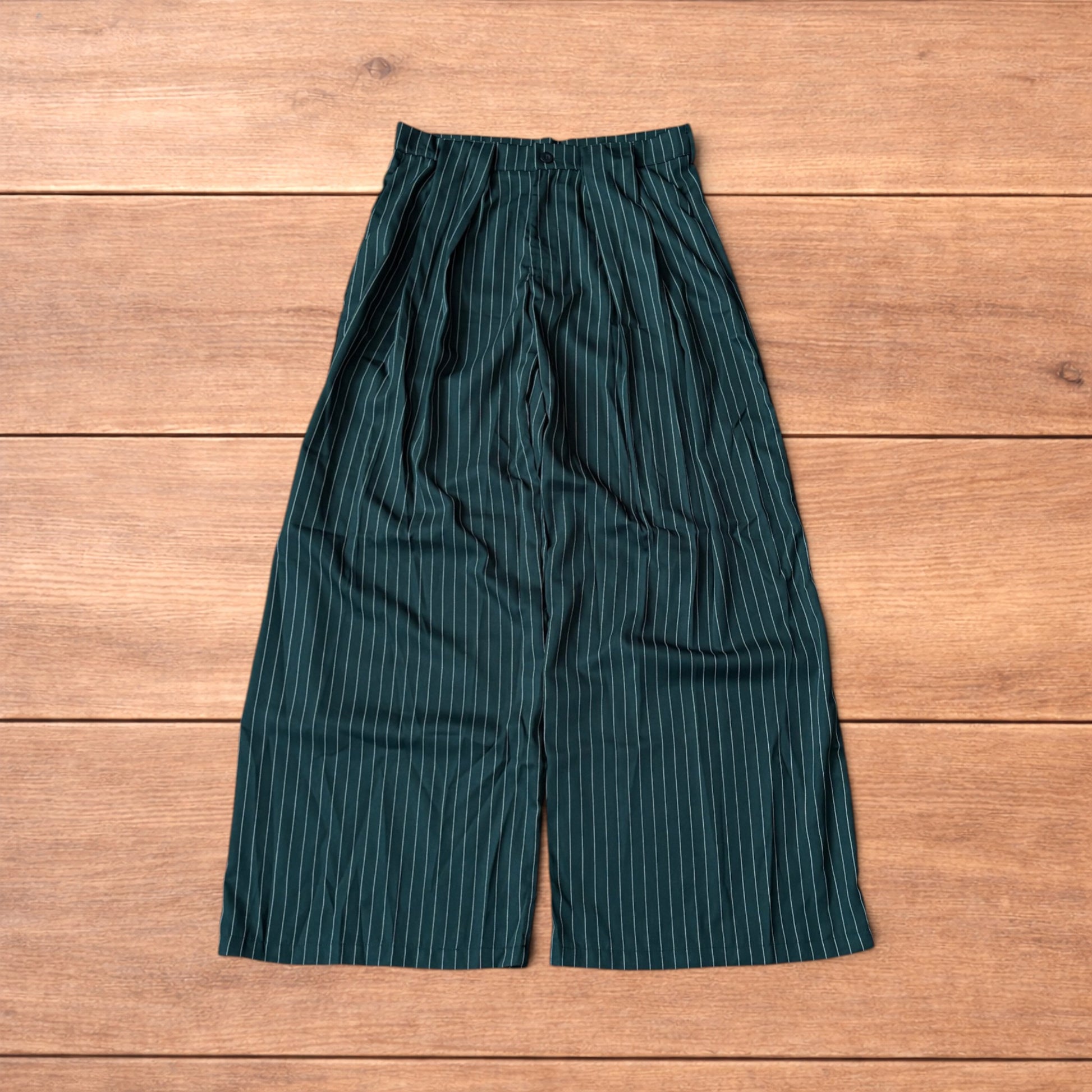 Vintage style baggy wide leg dark green trousers with white pinstripe, button and zip fastening, laid flat