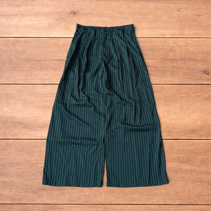 Vintage style baggy wide leg dark green trousers with white pinstripe, button and zip fastening, laid flat