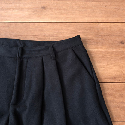 Vintage style baggy wide leg long tailored wool shorts in black.