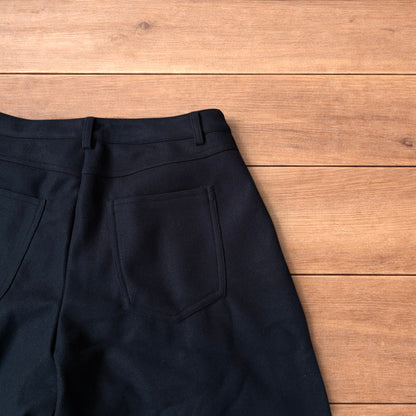 Vintage style baggy wide leg long tailored wool shorts in black.