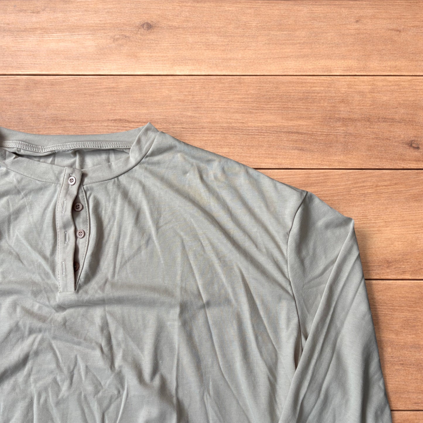 Relaxed fit Henley long sleeve top tshirt in beige.