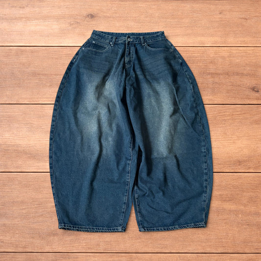 Super baggy wide leg balloon fit dark blue jeans laid flat showing front, back and pockets