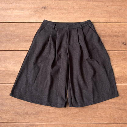 Vintage style baggy wide leg long tailored wool shorts in brown.