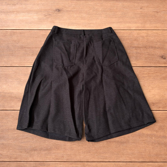 Vintage style baggy wide leg long tailored wool shorts in brown.
