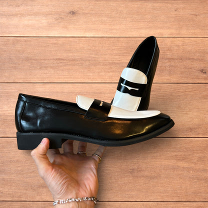 Lovely classic style penny loafers shoes in black and white design.