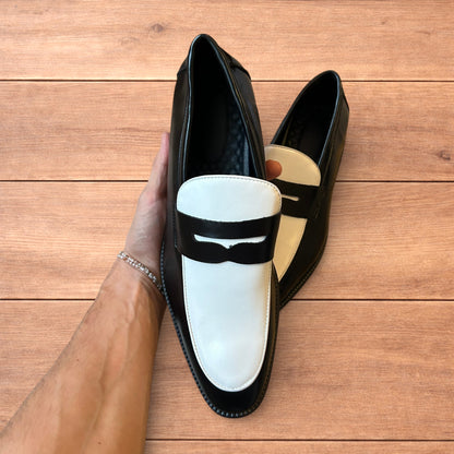 Lovely classic style penny loafers shoes in black and white design.