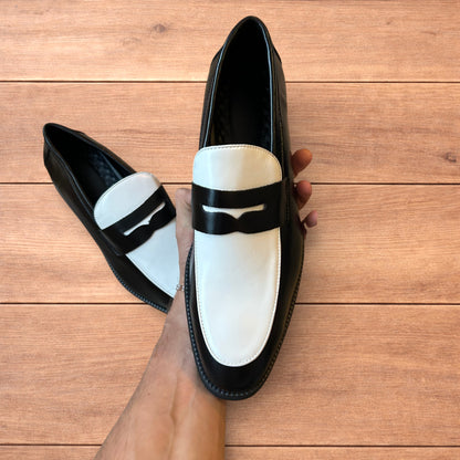 Lovely classic style penny loafers shoes in black and white design.